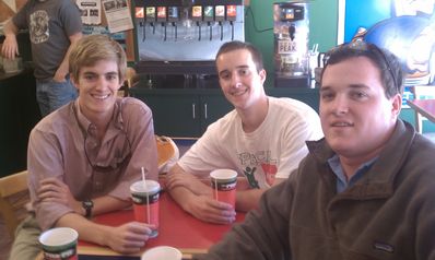 Group of veteran Falling Creek counselors at lunch with Goody.