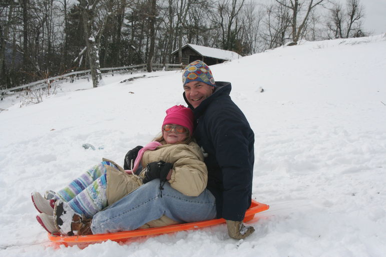 Yates and Mary going sledding at Falling Creek Camp
