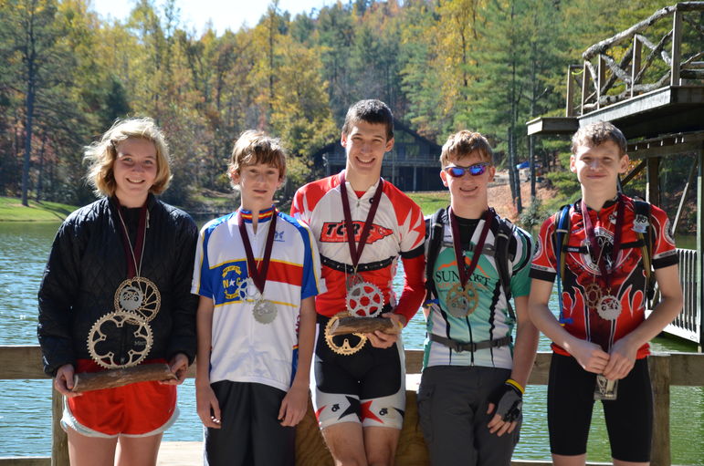 Annie Pharr. far left, and Mike Albrecht, far right, receive their awards in the 2011 CYMBL Race Championship