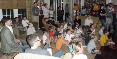 A Large group of Families in Nashville, TN watch the Falling Creek Camp Movie at The McKee's Home