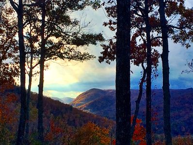 The leaves, rich in color, as the sun sets behind the mountains that overlook Falling Creek Camp in late October.