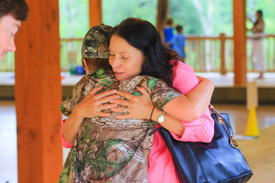 mom hugging boy