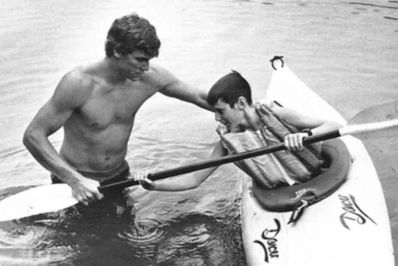 Yates teaches a camper how to roll in the 80's.