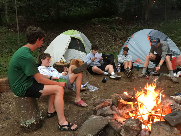 Without technology, there’s even more time for bonding around the campfire during an out-of-camp trip.